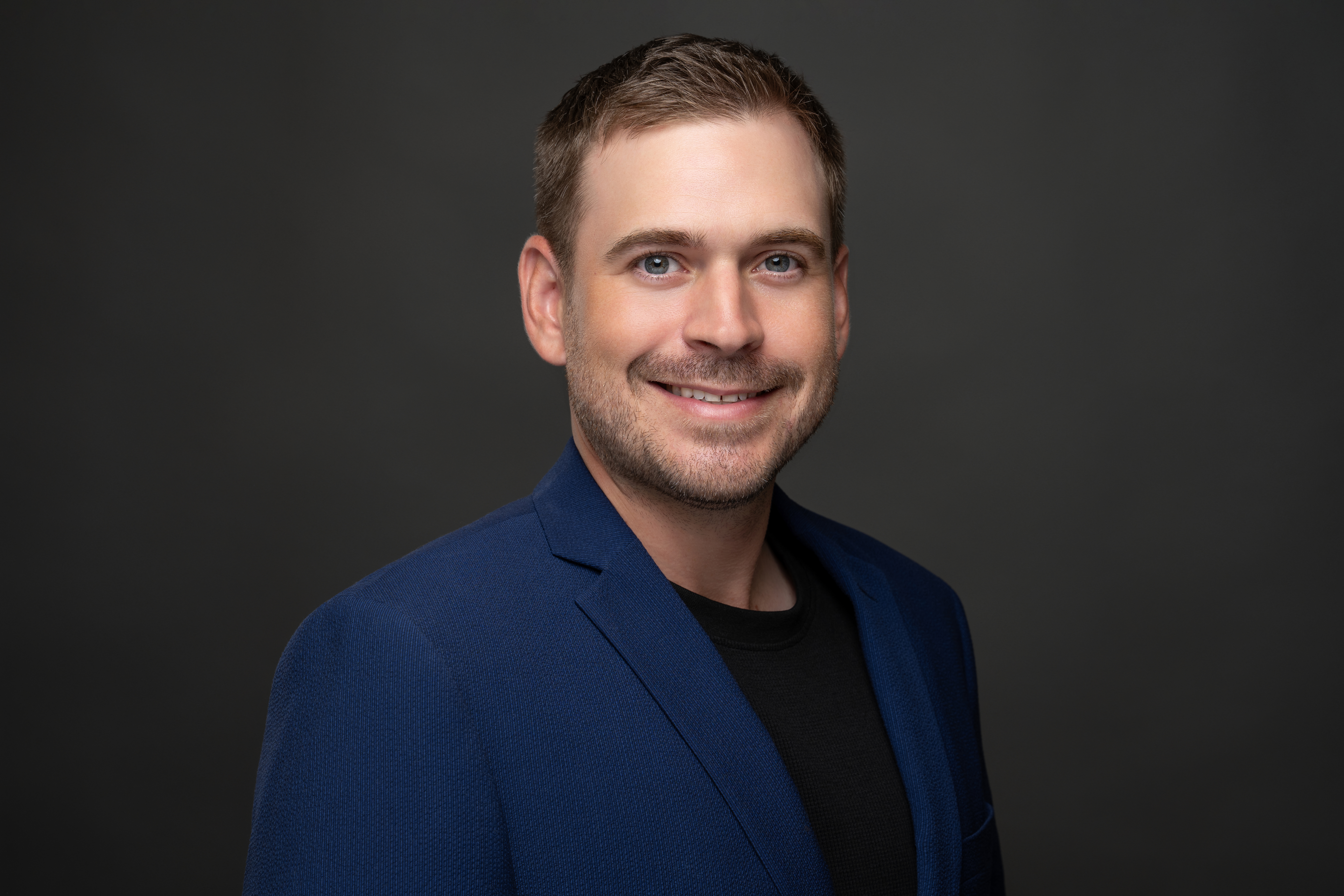 Happy family in front of new house